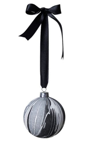 Black, white, grey and silver marbled bauble hanging on a black satin ribbon tied in a bow