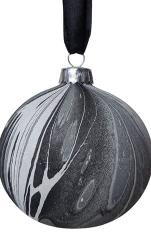 Monochrome marbled Christmas bauble on black ribbon