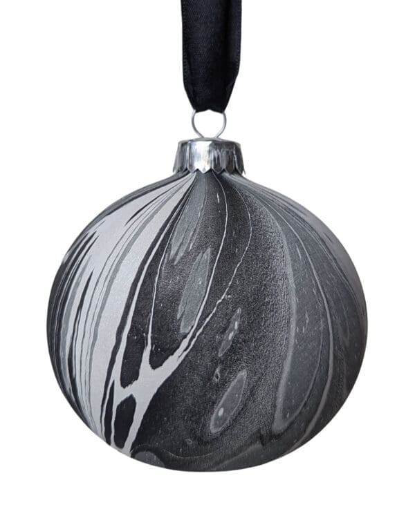 Monochrome marbled Christmas bauble on black ribbon