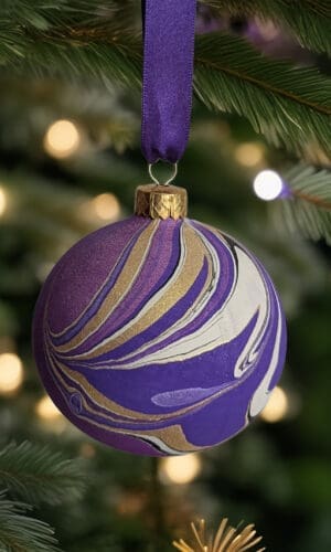 purple marbled Christmas bauble hanging on Christmas tree