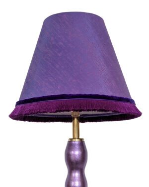 small conical purple fabric lampshade with silky plum fringing