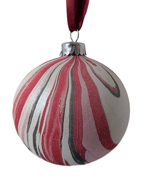 stripy Christmas bauble in red, pink and black